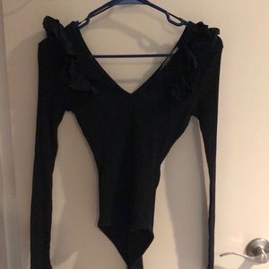 Black ribbed bodysuit w/ruffles at the shoulder